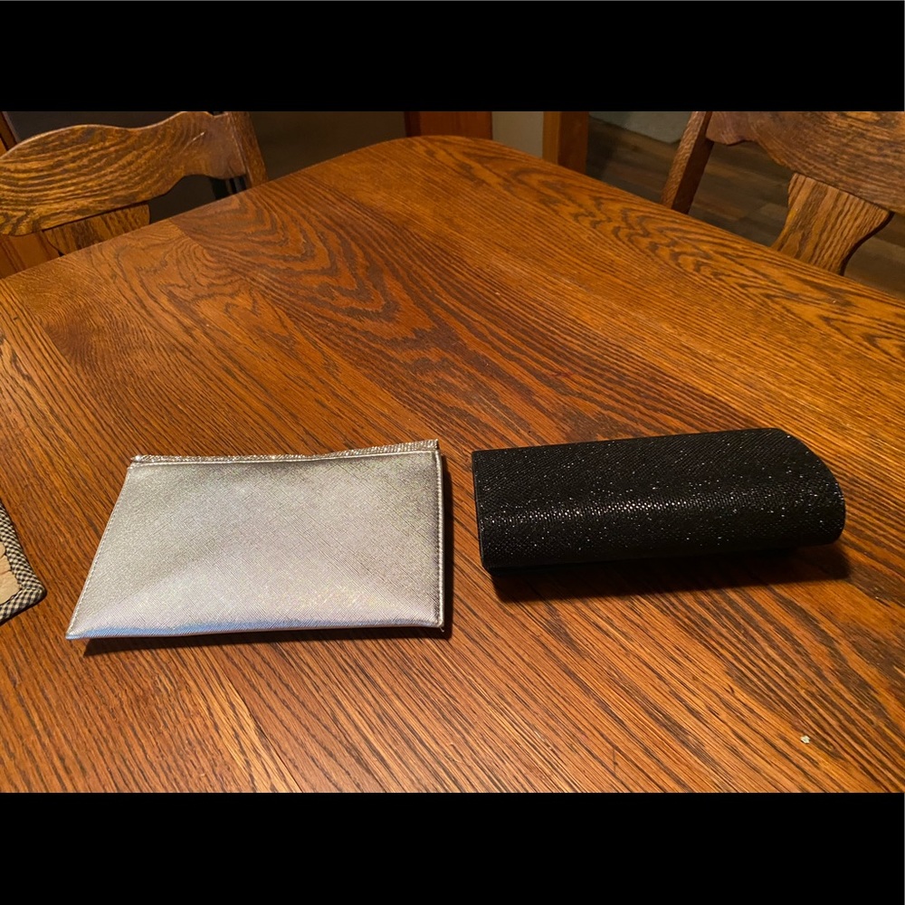 Two clutch handbags. Both carried one time.